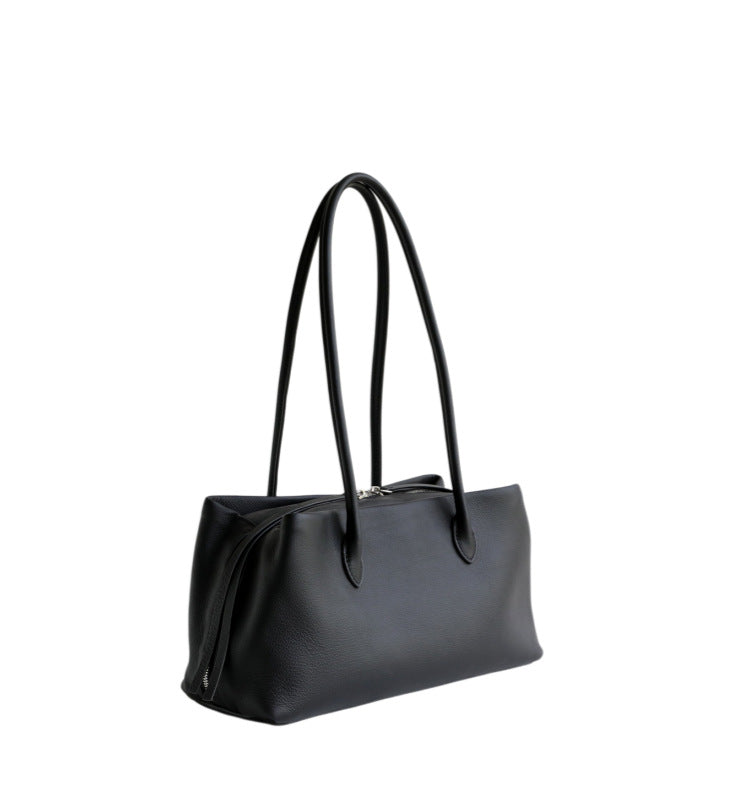 Black tote photographed from a low angled view
