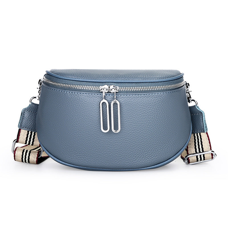 Blue-gray cowhide saddle bag with striped strap