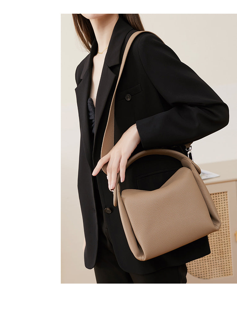 Crossbody carry style with adjustable strap on pebbled leather bag