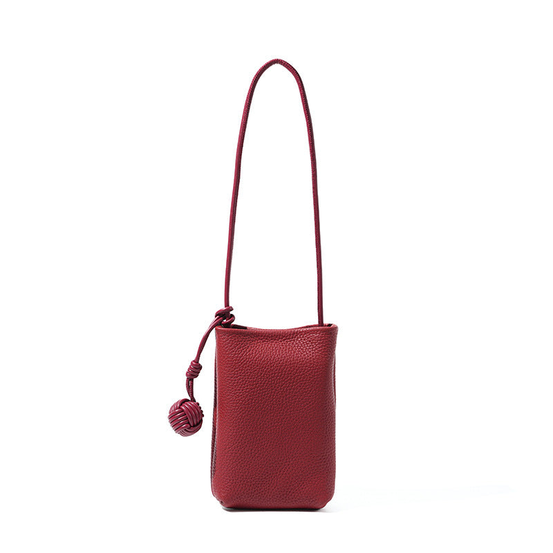 China red pebbled leather mini bucket phone crossbody bag with leather monkey-fist knot