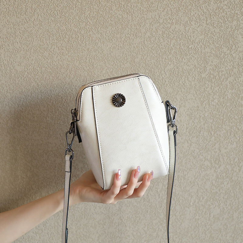 Cream white cowhide leather mini crossbody phone bag with floral clasp