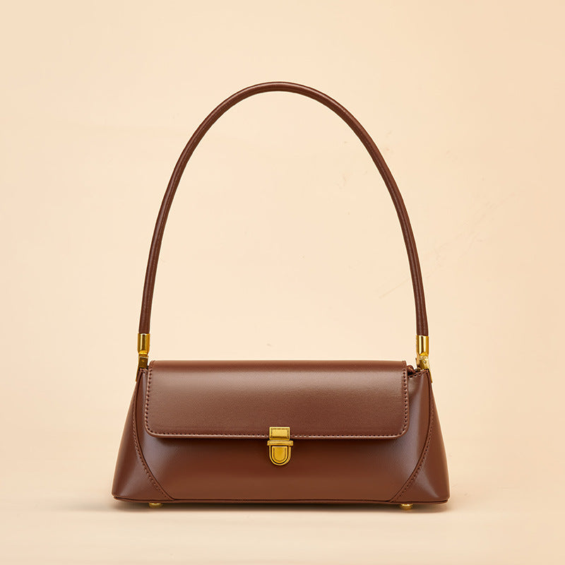 Coffee brown leather baguette handbag front view showing flap and lock