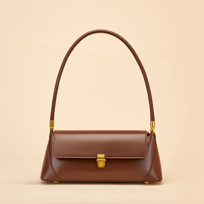 Coffee brown leather baguette handbag front view showing flap and lock