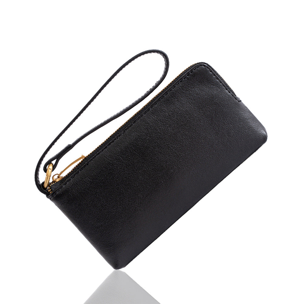 Black cowhide leather long wallet with detachable wrist strap on white background