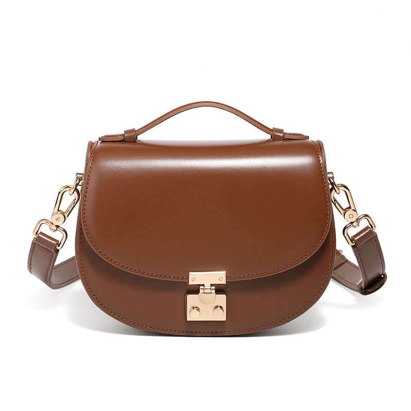 Brown cowhide leather mini saddle crossbody bag front view