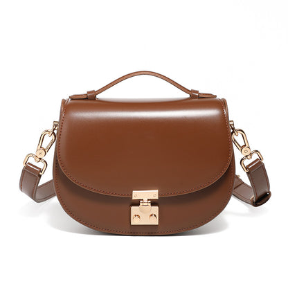 Brown cowhide leather mini saddle crossbody bag front view