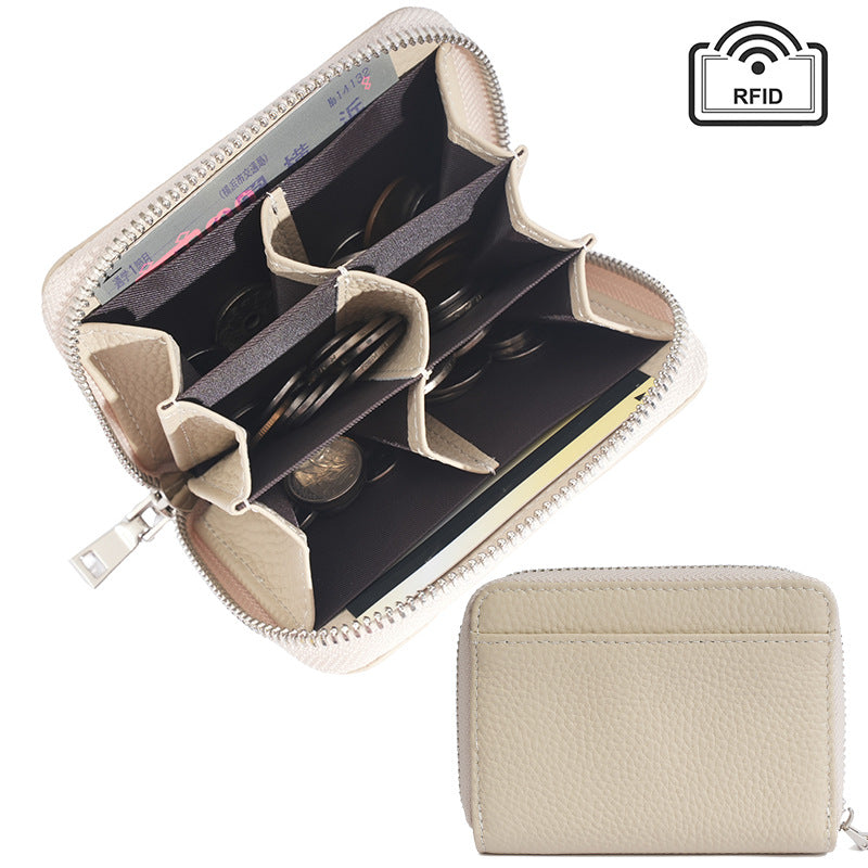 Ivory white leather coin wallet in flat lay arrangement