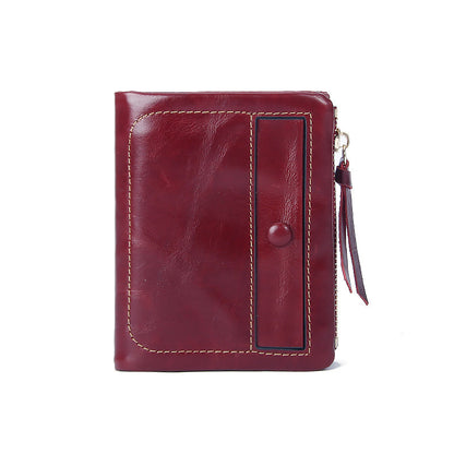 Burgundy top-grain cowhide vintage vertical short wallet showing front with snap flap and leather pull tab