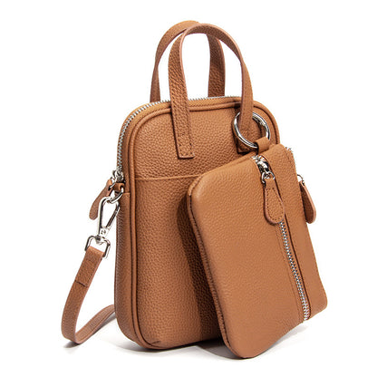 Golden Brown Mara cowhide crossbody bag with zip closure and hanging pouch