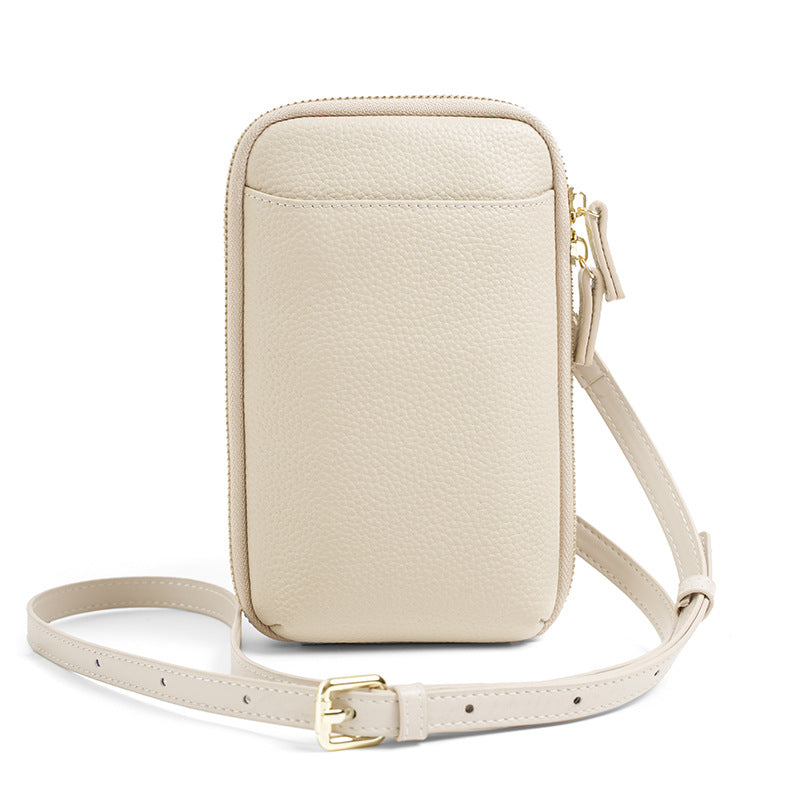 Ivory white leather crossbody phone bag with gold-tone hardware and adjustable strap