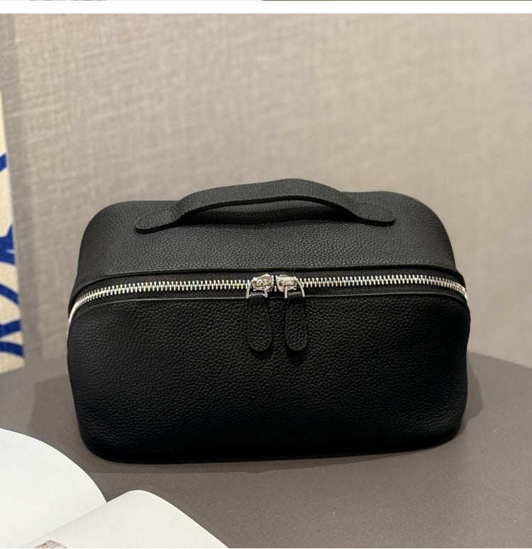Black pebbled cowhide makeup pouch with silver-colored zipper