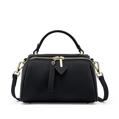 Black top-grain cowhide mini Boston bag with gold-tone hardware and dual zip top