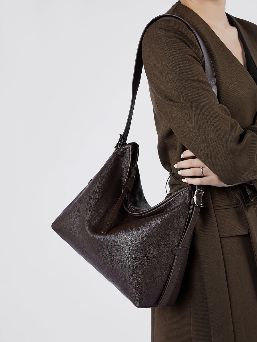 Havana leather bag worn on a model's shoulder