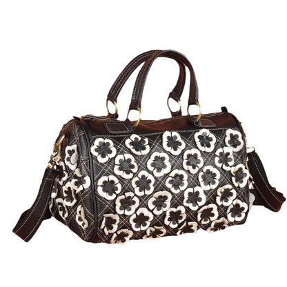 Black and white floral patchwork Boston bag with top handles