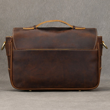 Back panel of dark brown leather camera bag