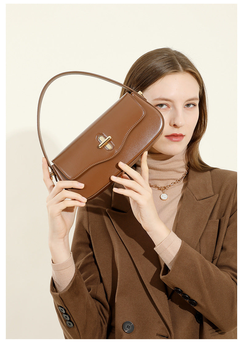 Close-up of fine topstitching on leather baguette bag