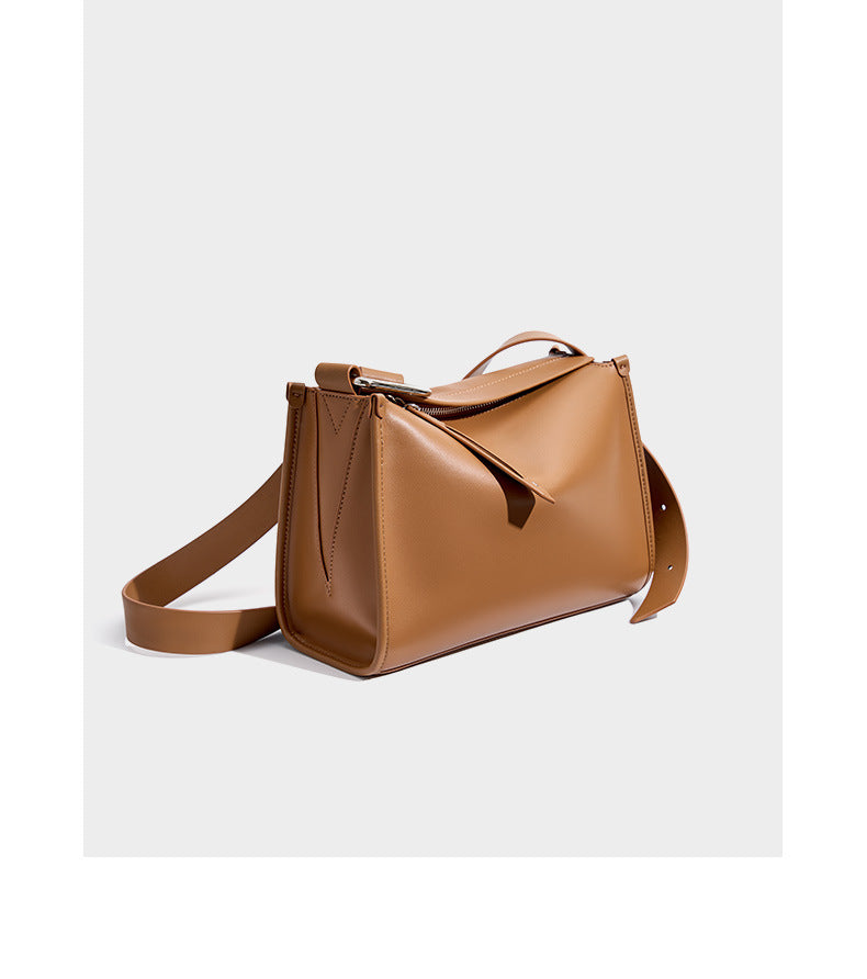 Brown pillow bag three-quarter angle with strap extended