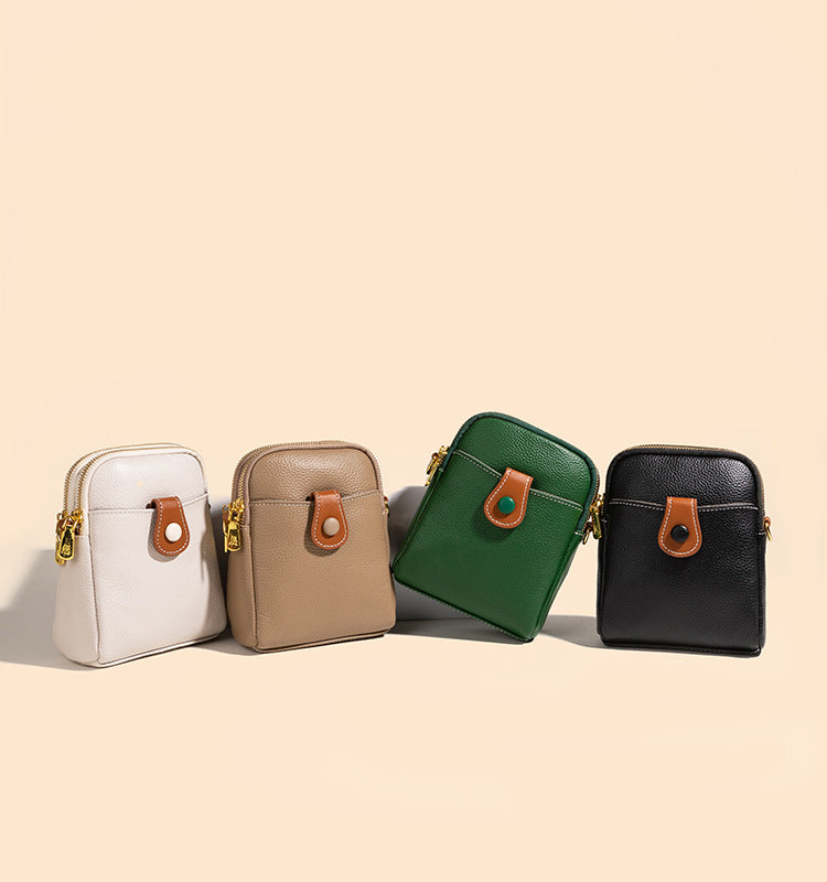 Four color lineup of cowhide phone bag in off-white, khaki, green, and black on beige background