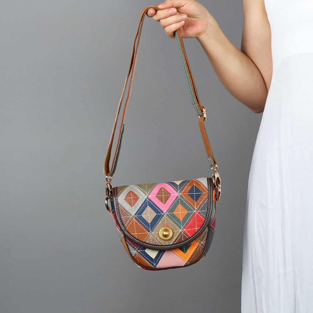 Crossbody bag worn on shoulder to show its compact shape