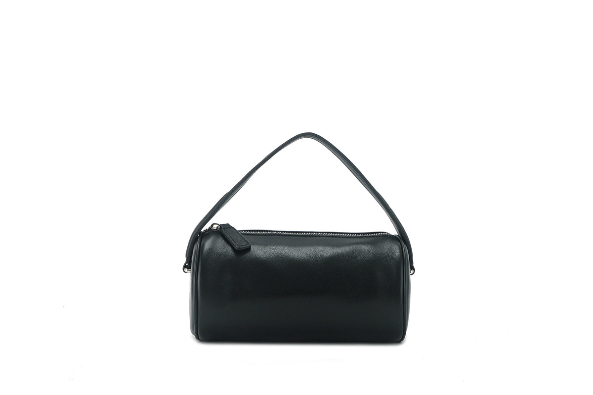 Black lambskin cylinder shoulder bag with zipper on a white background