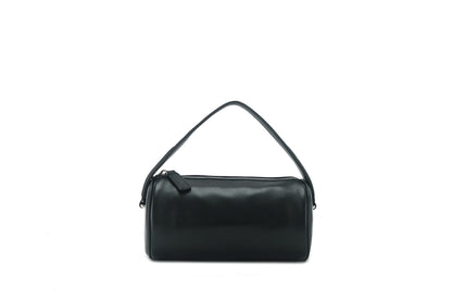 Black lambskin cylinder shoulder bag with zipper on a white background