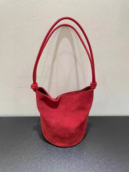 Red leather bucket bag shown from the front
