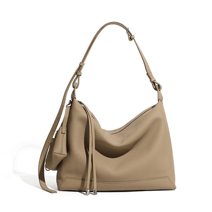 Front view of soft cowhide leather hobo shoulder bag in gray on white background