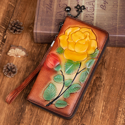 Vintage red-brown cowhide zip wallet with raised yellow flower and wrist strap