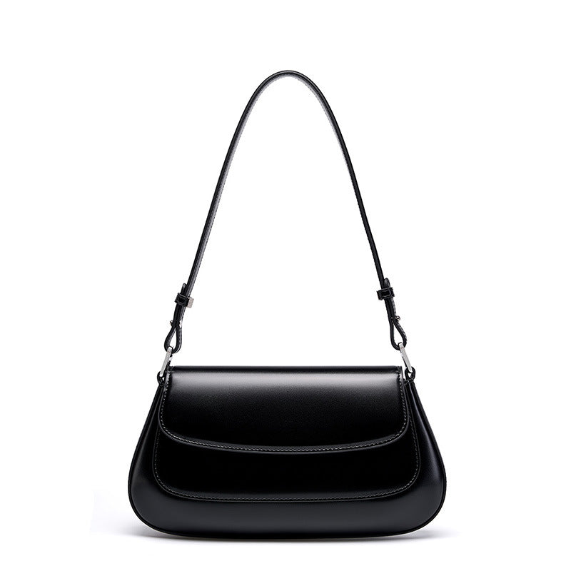 Black genuine leather baguette shoulder bag on white background