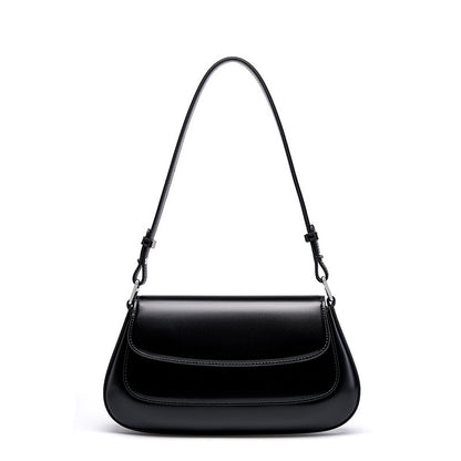 Black genuine leather baguette shoulder bag on white background