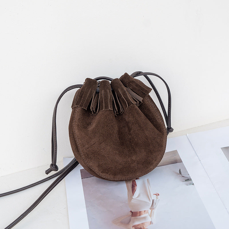 Coffee suede cowhide bucket bag with fringe, front view