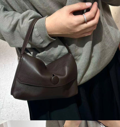 Close view of the coffee bag carried at the shoulder
