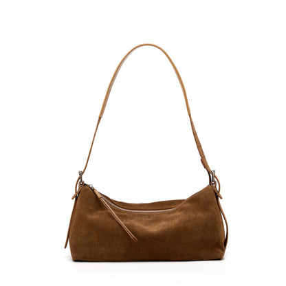 Caramel suede shoulder bag with long strap on white background