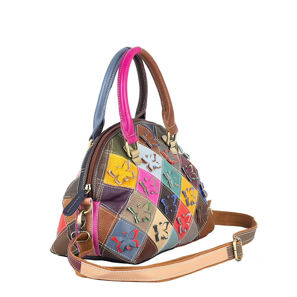 Angled view showing the bag's shell shape, zip closure, and shoulder strap