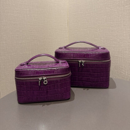 Two purple crocodile-embossed cowhide cosmetic pouches in different sizes