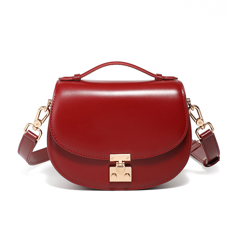 Red cowhide leather mini saddle crossbody bag front view