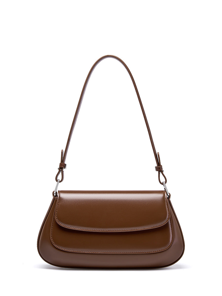 Brown genuine leather baguette shoulder bag on white background