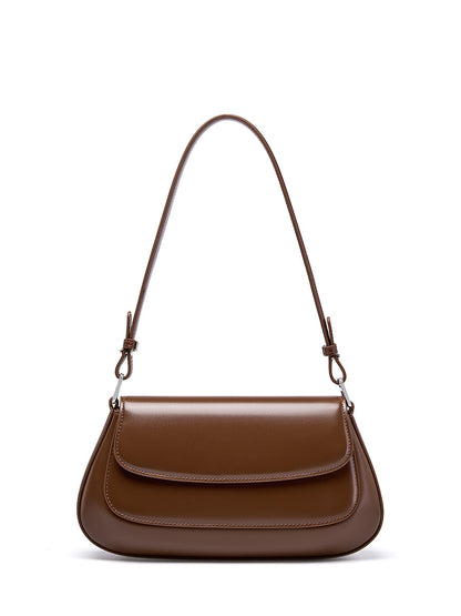Brown genuine leather baguette shoulder bag on white background