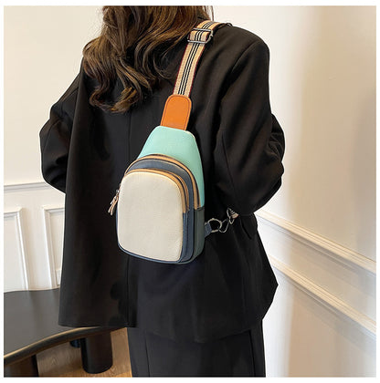 Rear view of cream-front colorblock sling bag