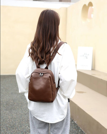 Coffee brown leather backpack shown from the rear