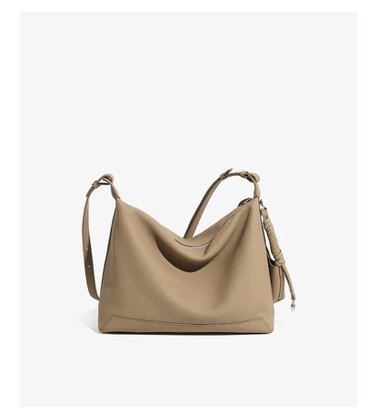 Back view of gray cowhide leather hobo bag showing adjustable strap