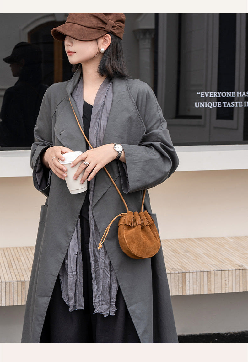 Coffee and caramel color options for a fringe bucket bag