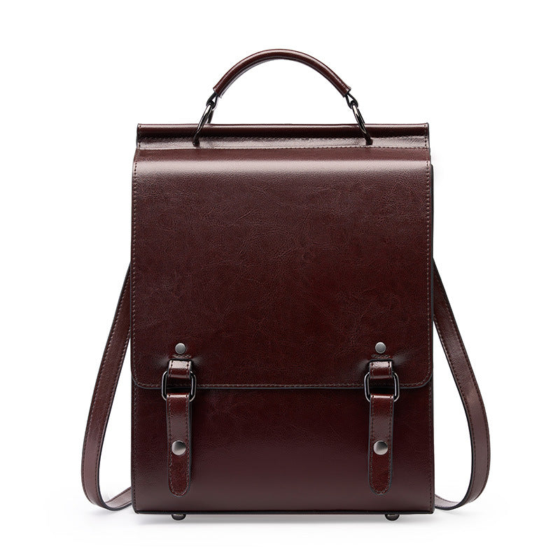 Brown cowhide leather backpack with buckle flap front view