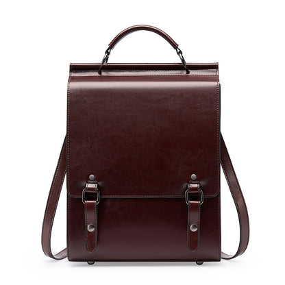 Brown cowhide leather backpack with buckle flap front view