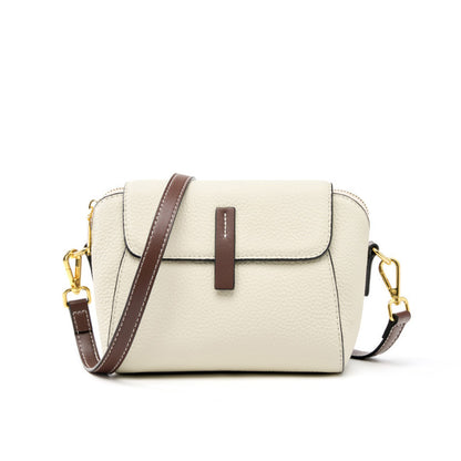 Ivory top-grain cowhide shell crossbody bag with brown leather pull tab and gold-tone hardware