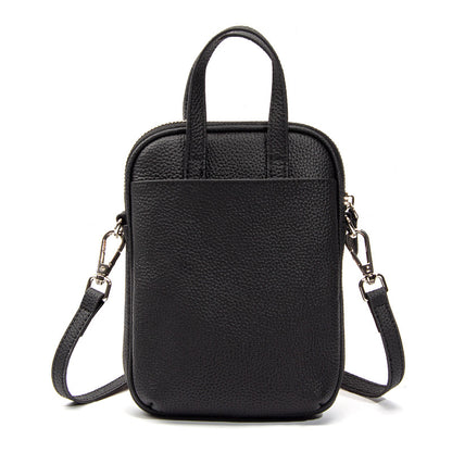 Black Mara cowhide crossbody bag back view with detachable strap attached