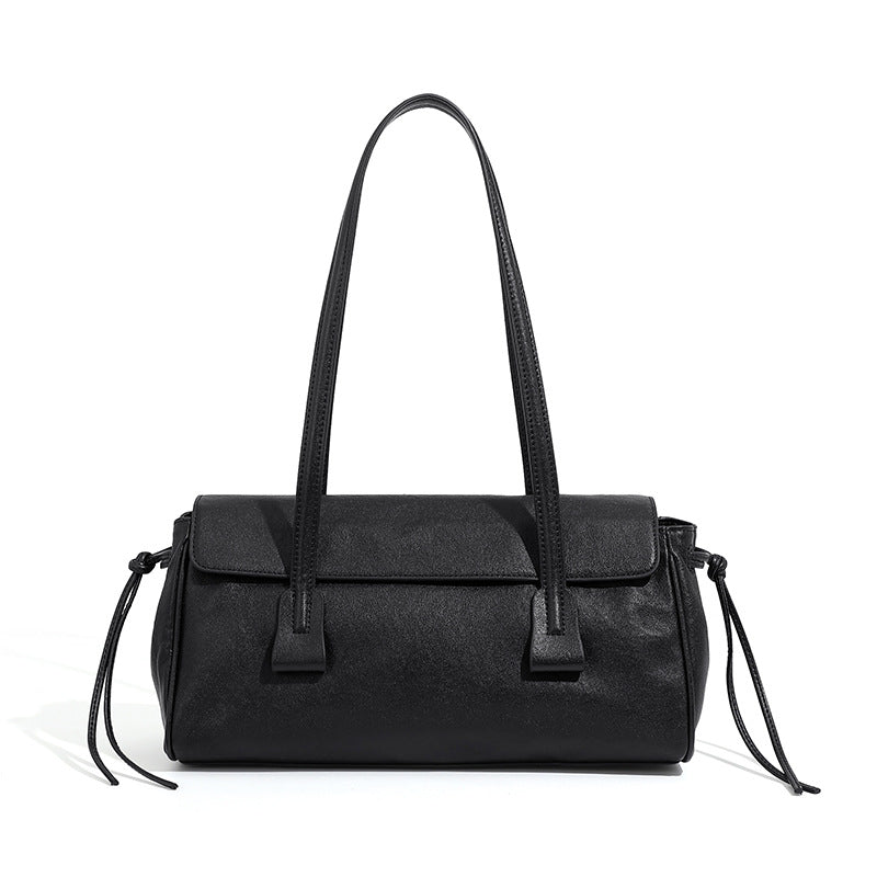 Black cowhide leather shoulder bag with top handles on white background