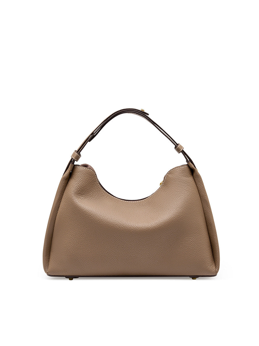 Light gray cowhide leather shoulder bag front view on white background