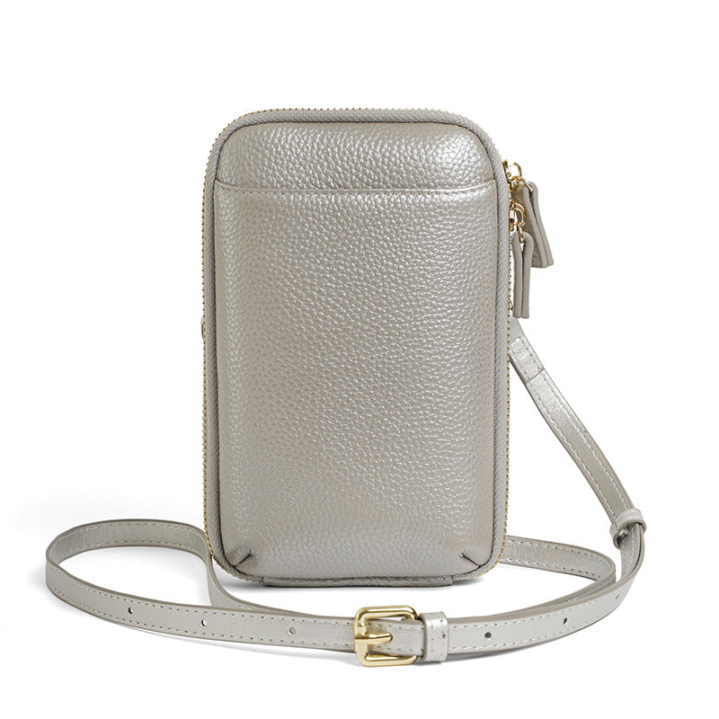 Silver metallic leather crossbody phone bag with adjustable buckle strap