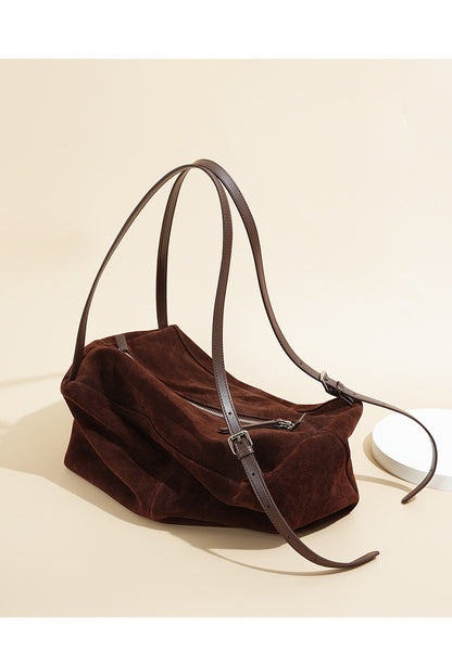 Top view of the tote showing its zip closure and adjustable shoulder straps